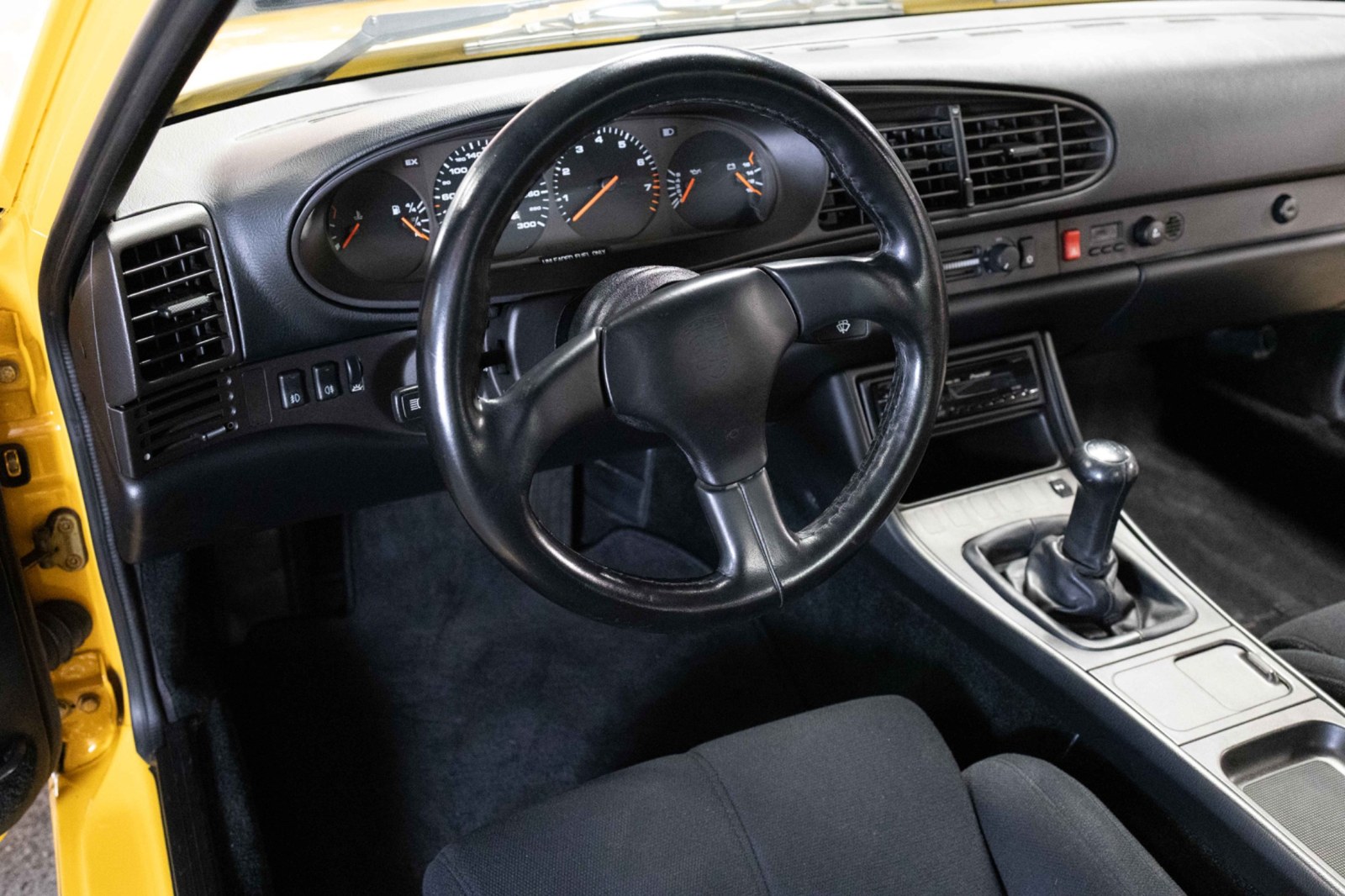 Porsche 968 Club Sport cockpit with color-backed seats and black dashboard